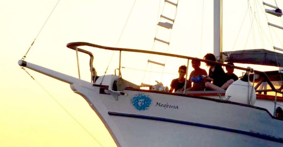 Santorini: Traditional Wooden Boat Tour with Meal and Wine - Greek food, local wine, and a proper meal