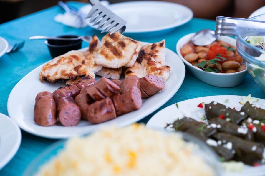 Santorini: Traditional Wooden Boat Tour with Meal and Wine - Sunset sailing from Ammoudi to Vlychada