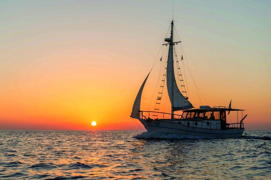 Santorini: Traditional Wooden Boat Tour with Meal and Wine - The wooden boat, crew, and possible catamaran change