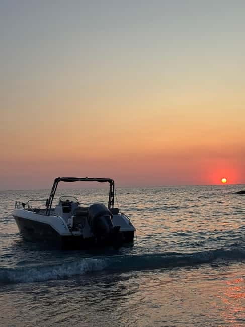 Sarandë: Sunset boat tour with local wine - Leaving Sarandë as the afternoon fades