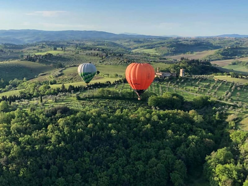 Siena: Balloon Flight Over Tuscany with a Glass of Wine - Landing in a Tuscan field