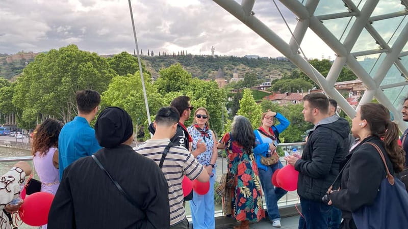 Tbilisi: Evening Walking Tour with Wine & Boat Ride Options - Rezo Gabriadze’s clock tower and puppet theatre