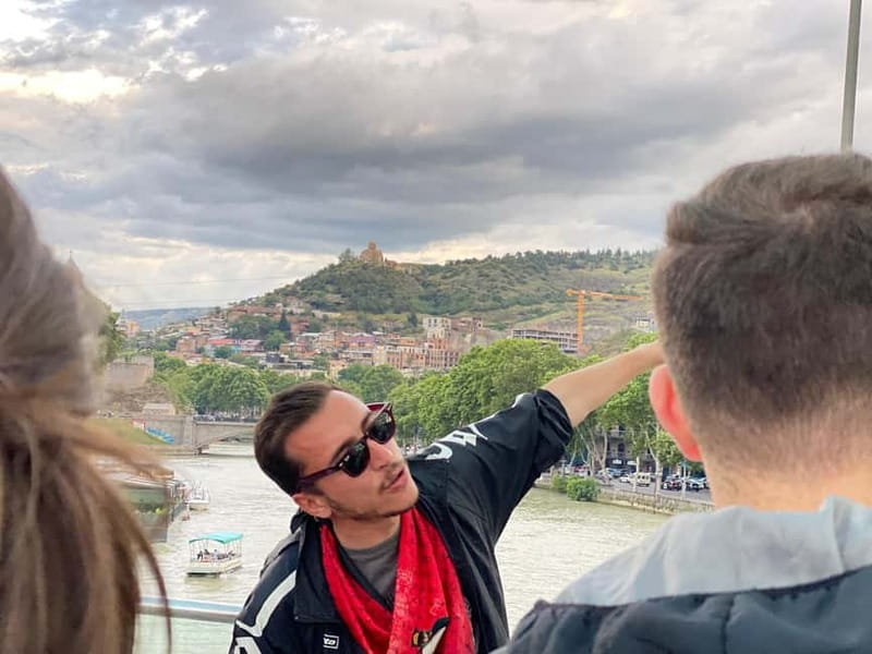 Tbilisi: Evening Walking Tour with Wine & Boat Ride Options - The Bridge of Peace after dark