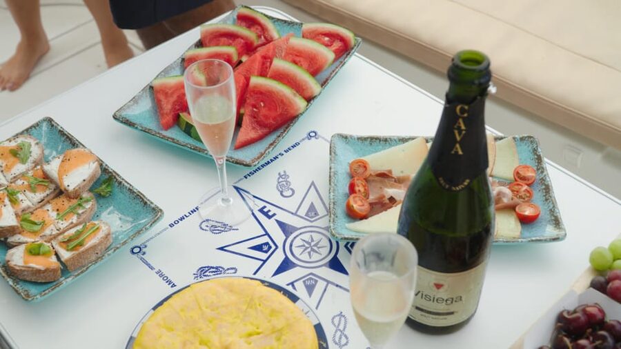 Tenerife: Shared Yacht Cruise with Champagne and Tapas - The crew makes the small boat work