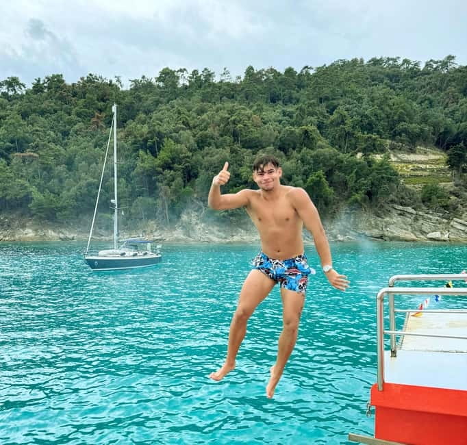 Thassos: Full-Day Cruise with BBQ, Wine, and Swim Stops - Cruising past rocky headlands and pine-lined bays