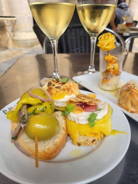 The Original Bilbao Food Tour with Wine Pairings - Traditional pintxos and prize-winning creations