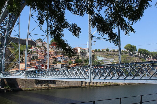 Wine Tasting with Tapas Walking Tour in Porto - Starting beneath the Ponte Luís I