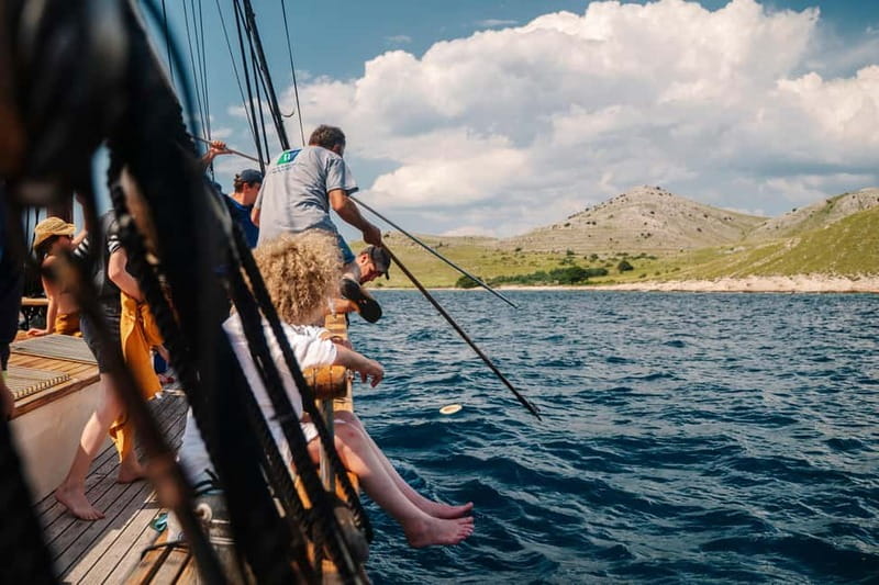 Zadar: Boat Tour with Unlimited Wine & 3 Stops - Boarding the 120-year-old wooden boat